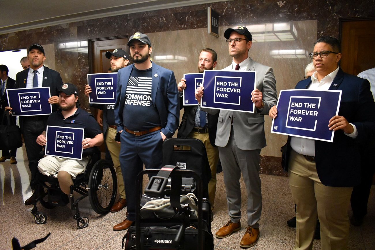 Alexander McCoy leading a demonstration outside the Armed Services Committee